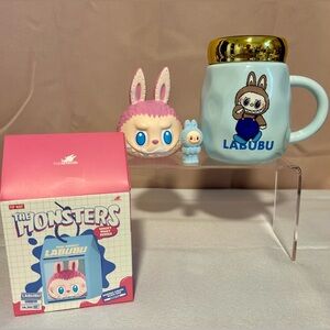 Pop Mart The Monsters blind box stress ball, mug and mini figure.